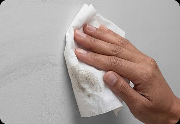 Wiping a wall with a lead dust wipe